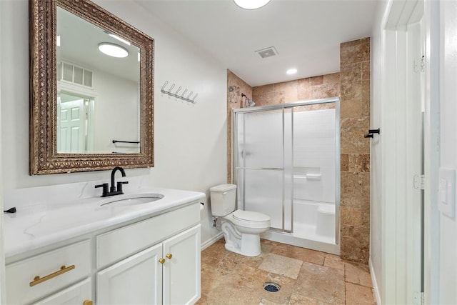 2800 E 15th St, Edmond, OK 73013 - full bathroom featuring vanity, stone tile flooring, and a shower stall