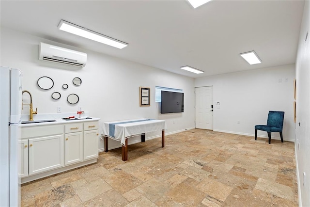 2800 E 15th St, Edmond, OK 73013 - misc room with stone tile floors and a wall mounted air conditioner