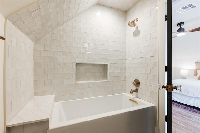 814 NE 18th St, Oklahoma City, OK 73105 - ensuite bathroom featuring washtub / shower combination and a ceiling fan