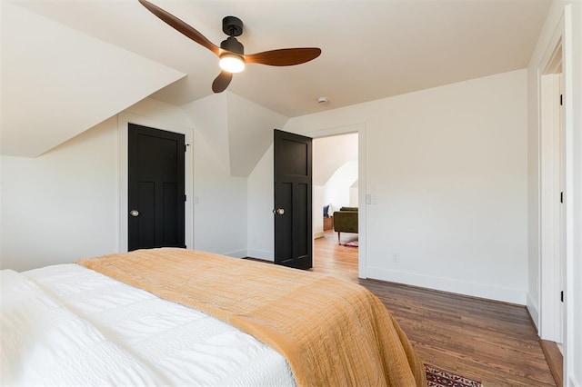814 NE 18th St, Oklahoma City, OK 73105 - bedroom featuring wood finished floors, vaulted ceiling, and a ceiling fan