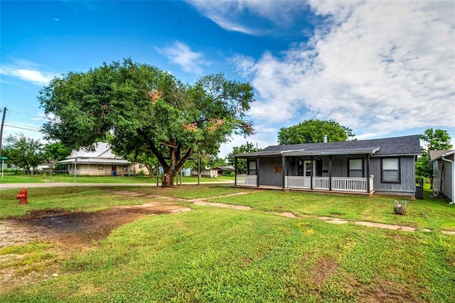 201 E 2nd St, Stroud, OK 74079 - view of grassy yard featuring covered porch