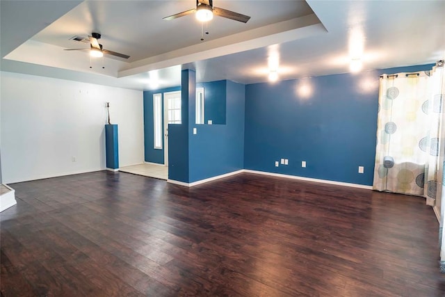 201 E 2nd St, Stroud, OK 74079 - empty room with a ceiling fan, wood finished floors, and a raised ceiling