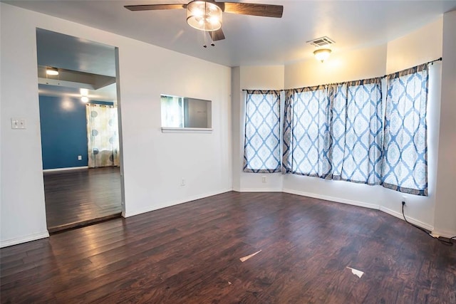 201 E 2nd St, Stroud, OK 74079 - spare room featuring a ceiling fan, wood finished floors, and plenty of natural light