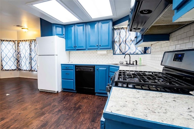201 E 2nd St, Stroud, OK 74079 - kitchen with black dishwasher, blue cabinetry, stainless steel range with gas cooktop, freestanding refrigerator, and dark wood-type flooring