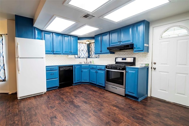 201 E 2nd St, Stroud, OK 74079 - kitchen featuring freestanding refrigerator, black dishwasher, gas stove, blue cabinets, and under cabinet range hood