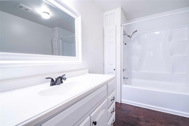 201 E 2nd St, Stroud, OK 74079 - full bathroom with vanity, wood finished floors, and bathtub / shower combination