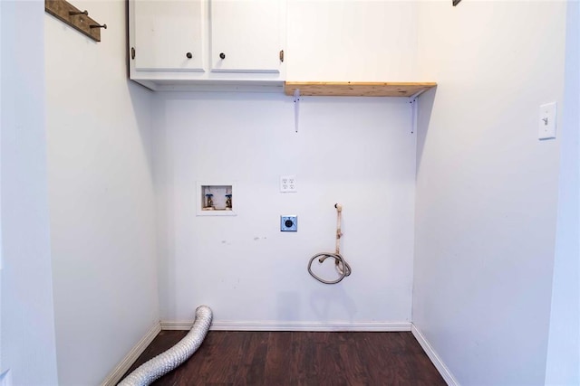 201 E 2nd St, Stroud, OK 74079 - laundry room with hookup for an electric dryer, dark wood-style flooring, washer hookup, and cabinet space