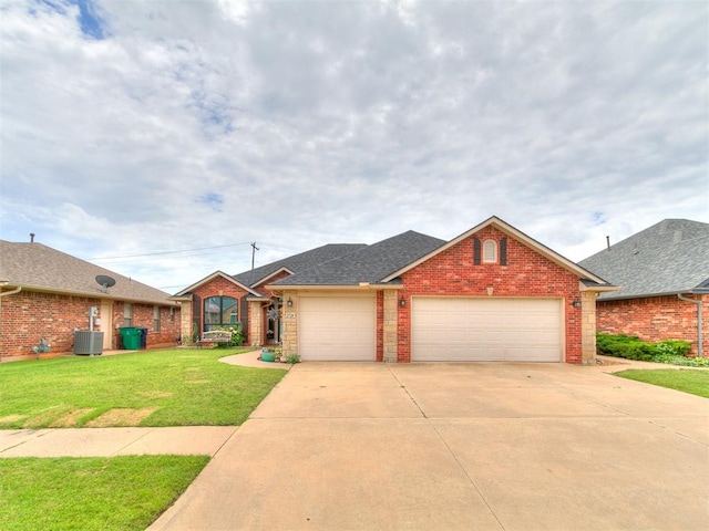 2724 SE 97th St, Oklahoma City, OK 73160 - view of front of home featuring a garage, brick siding, concrete driveway, and a front yard