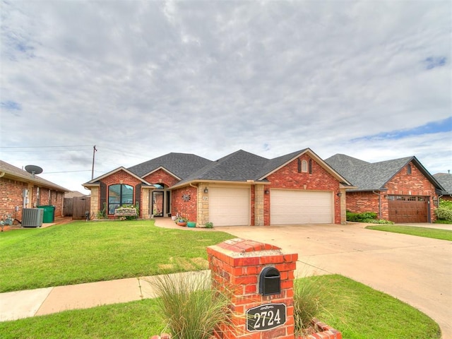 2724 SE 97th St, Oklahoma City, OK 73160 - view of front of house with an attached garage, brick siding, concrete driveway, and roof with shingles