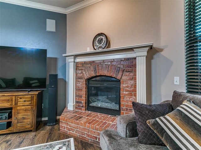 2724 SE 97th St, Oklahoma City, OK 73160 - living room featuring wood finished floors, a brick fireplace, and ornamental molding
