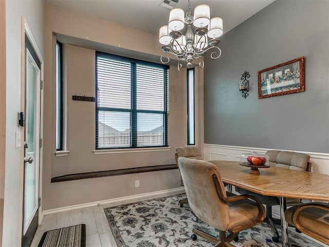 2724 SE 97th St, Oklahoma City, OK 73160 - dining room with a chandelier and wood finished floors