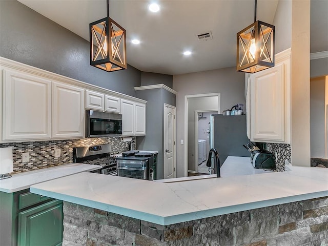 2724 SE 97th St, Oklahoma City, OK 73160 - kitchen featuring stainless steel appliances, backsplash, white cabinetry, a peninsula, and pendant lighting