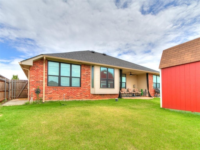 2724 SE 97th St, Oklahoma City, OK 73160 - back of property with ceiling fan, a patio area, and brick siding