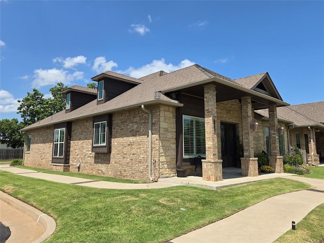 9252 Elaine Dr, Midwest City, OK 73130 - view of side of property with a yard, roof with shingles, and brick siding