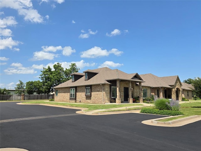 9252 Elaine Dr, Midwest City, OK 73130 - view of front of house with brick siding and roof with shingles