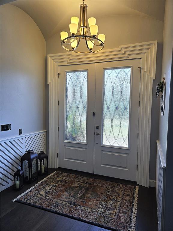 9252 Elaine Dr, Midwest City, OK 73130 - entryway featuring vaulted ceiling, a chandelier, and french doors