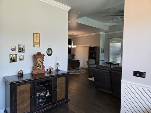 9252 Elaine Dr, Midwest City, OK 73130 - living area with crown molding, dark wood-style flooring, and a chandelier