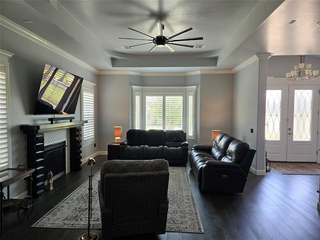 9252 Elaine Dr, Midwest City, OK 73130 - living area featuring a raised ceiling, hardwood / wood-style floors, a chandelier, and a ceiling fan