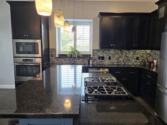 9252 Elaine Dr, Midwest City, OK 73130 - kitchen with stainless steel appliances, a large island, tasteful backsplash, and dark stone countertops