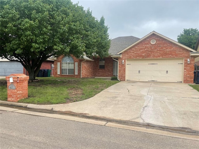5725 SE 86th St, Oklahoma City, OK 73135 - view of front of property with brick siding, driveway, an attached garage, and a front yard