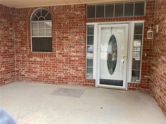 5725 SE 86th St, Oklahoma City, OK 73135 - property entrance with brick siding and a patio