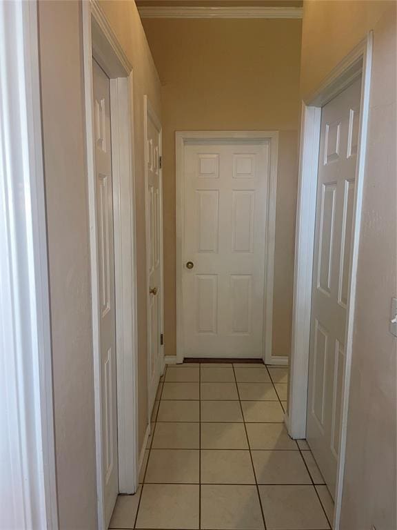 5725 SE 86th St, Oklahoma City, OK 73135 - hallway featuring light tile patterned floors and ornamental molding