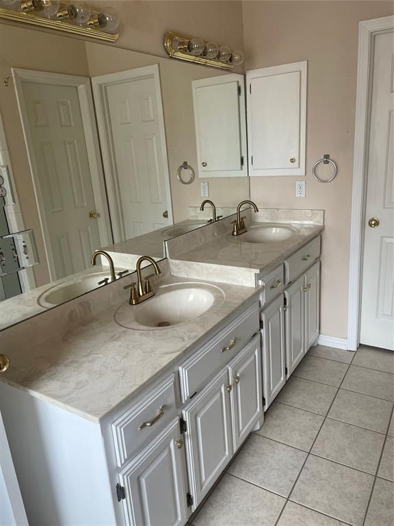 5725 SE 86th St, Oklahoma City, OK 73135 - full bathroom with double vanity and tile patterned floors