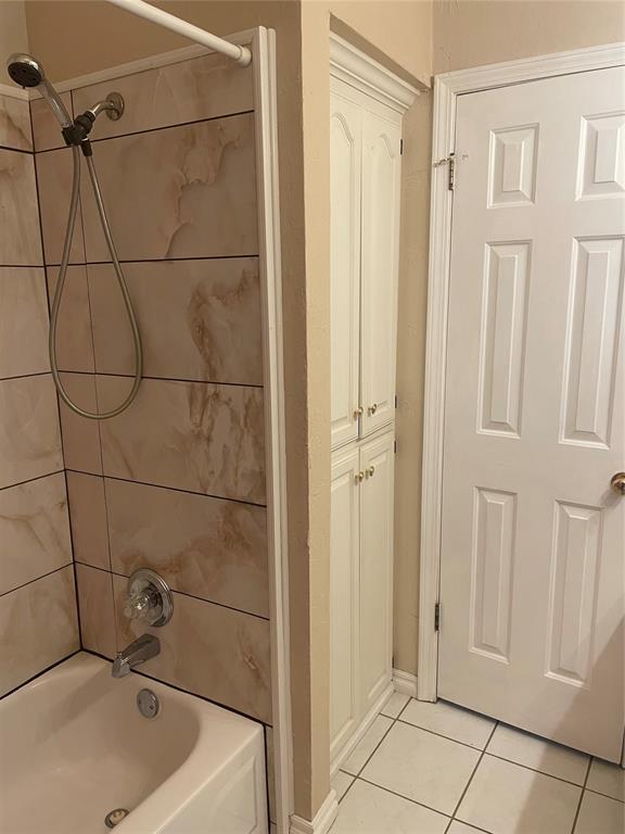 5725 SE 86th St, Oklahoma City, OK 73135 - bathroom featuring tile patterned floors and shower / bath combination
