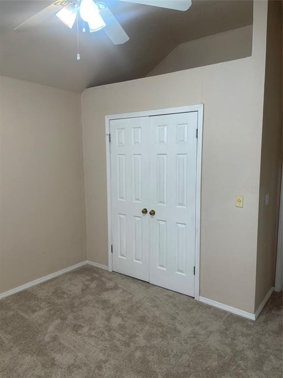 5725 SE 86th St, Oklahoma City, OK 73135 - unfurnished bedroom featuring carpet, vaulted ceiling, a closet, and a ceiling fan