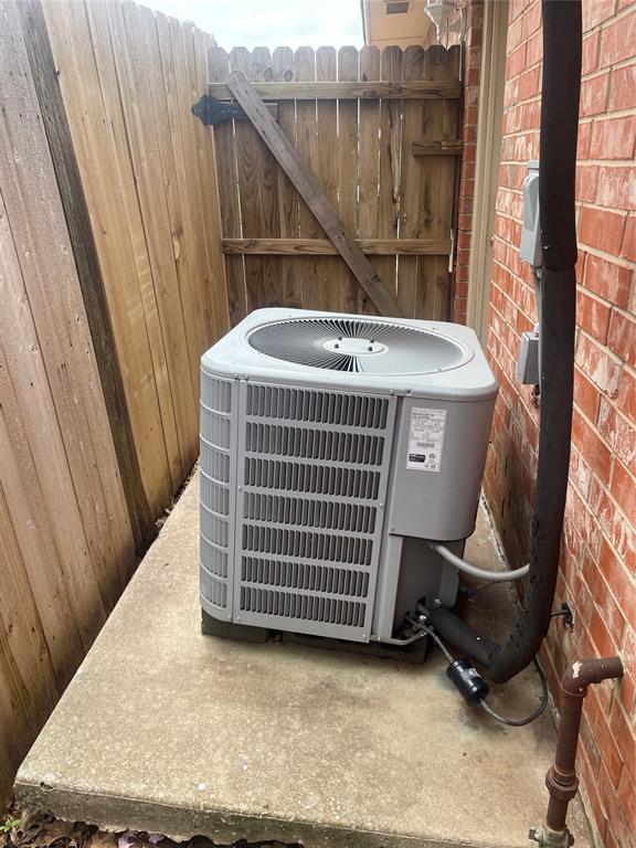5725 SE 86th St, Oklahoma City, OK 73135 - exterior view of a central air condition unit and brick siding