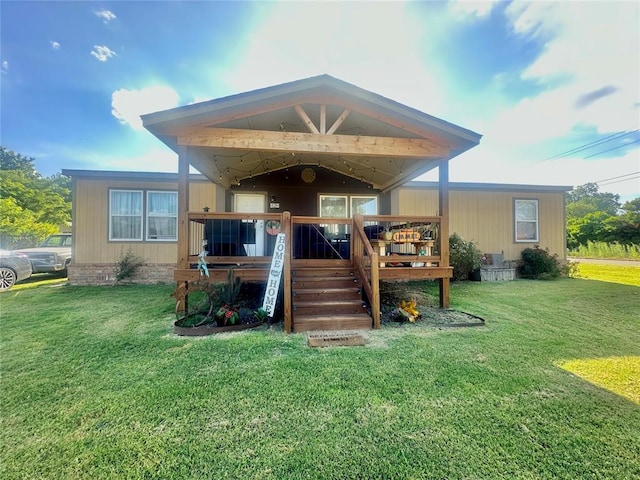 420 N College St, Cordell, OK 73632 - rear view of property featuring a wooden deck and a lawn