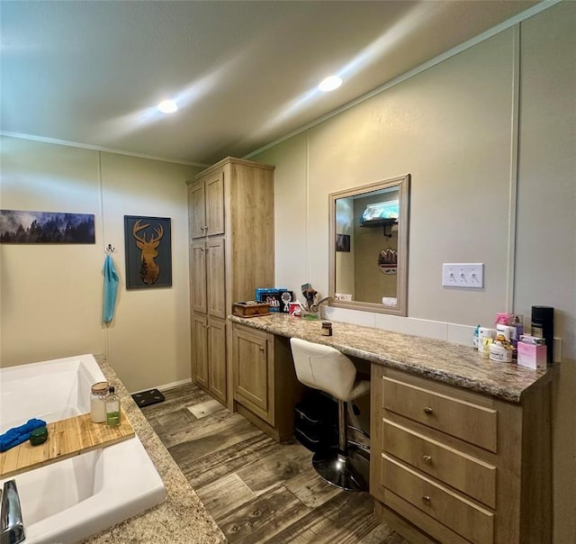 420 N College St, Cordell, OK 73632 - full bathroom with wood finished floors, vanity, ornamental molding, a bathtub, and recessed lighting