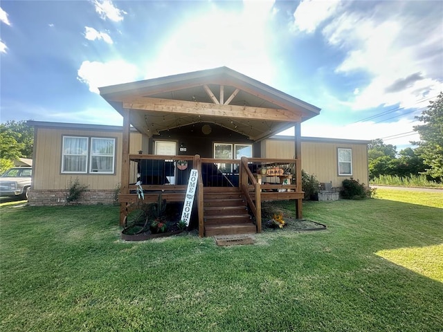 420 N College St, Cordell, OK 73632 - view of front of property featuring a front yard, a wooden deck, and stairs