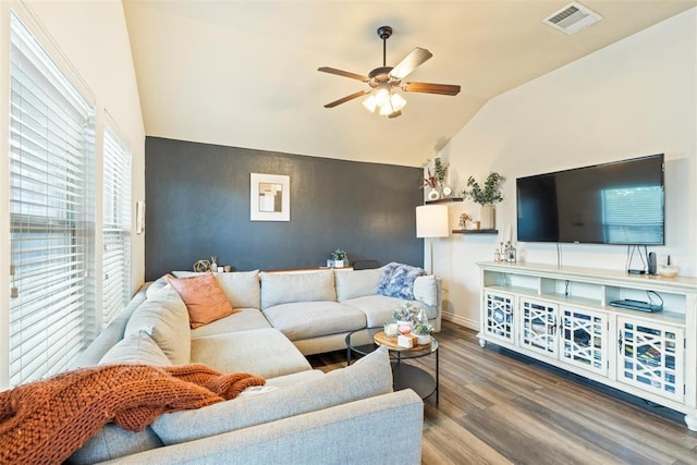 2548 NW 184th St, Edmond, OK 73012 - living area featuring lofted ceiling, ceiling fan, wood finished floors, and an accent wall