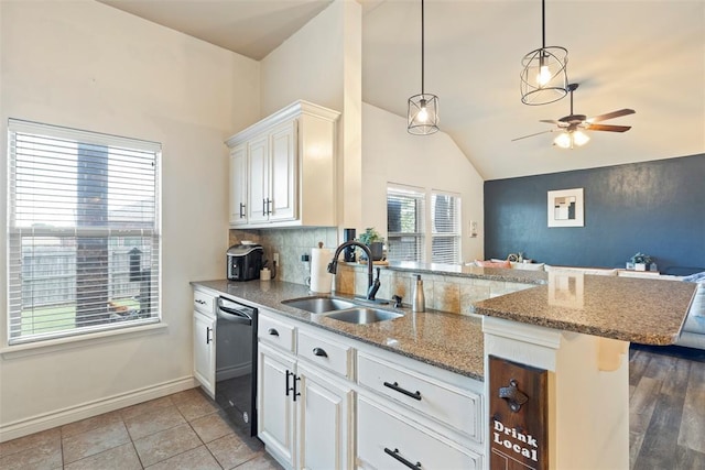 2548 NW 184th St, Edmond, OK 73012 - kitchen featuring black dishwasher, lofted ceiling, a peninsula, a ceiling fan, and open floor plan