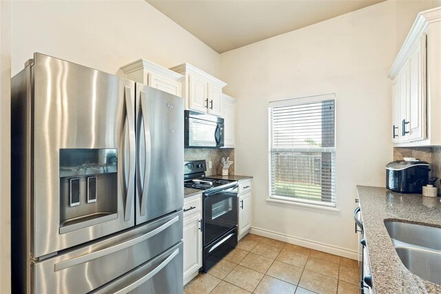 2548 NW 184th St, Edmond, OK 73012 - kitchen with black appliances, backsplash, white cabinetry, and light tile patterned floors