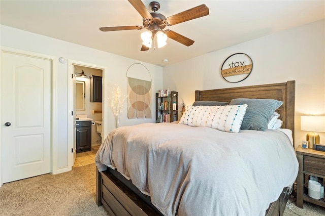 2548 NW 184th St, Edmond, OK 73012 - bedroom with light carpet, ensuite bath, and ceiling fan