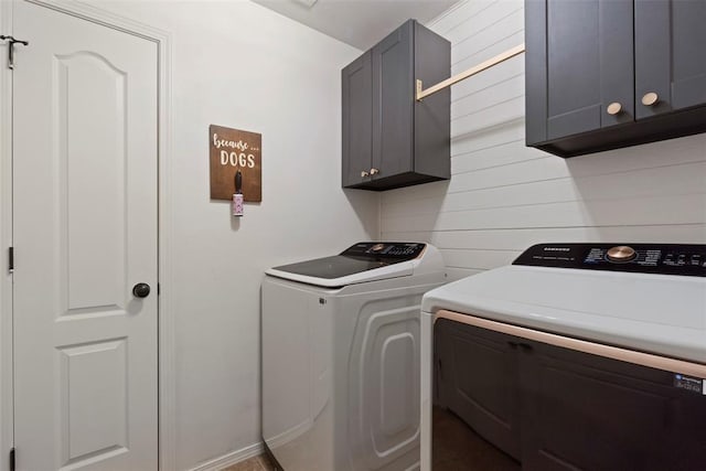 2548 NW 184th St, Edmond, OK 73012 - washroom featuring independent washer and dryer, cabinet space, and wooden walls