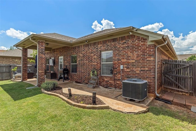 2548 NW 184th St, Edmond, OK 73012 - rear view of house featuring brick siding and a patio area