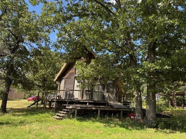 11825 N 3660th Rd, Cromwell, OK 74884 - rear view of house with a wooden deck and a lawn