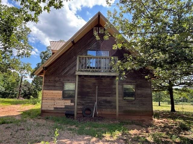 11825 N 3660th Rd, Cromwell, OK 74884 - view of side of property featuring a balcony and a metal roof