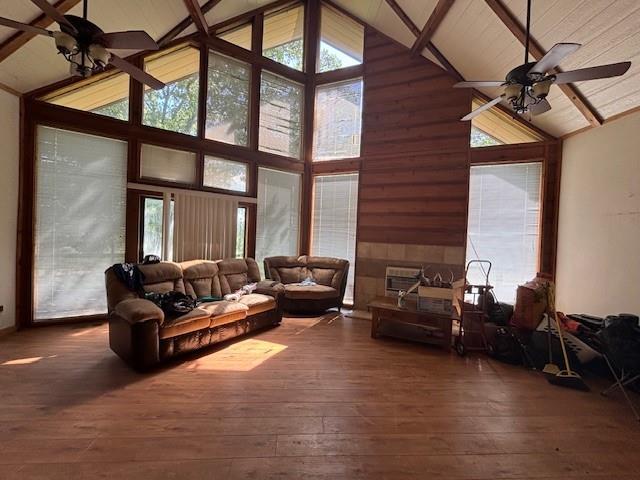 11825 N 3660th Rd, Cromwell, OK 74884 - living room featuring high vaulted ceiling, ceiling fan, wood-type flooring, and beam ceiling