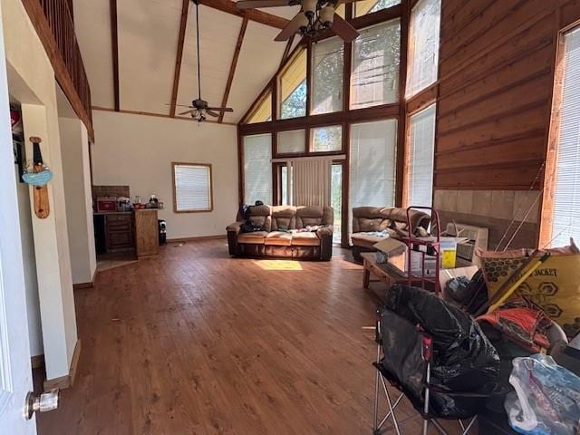 11825 N 3660th Rd, Cromwell, OK 74884 - living room featuring a ceiling fan, high vaulted ceiling, wood finished floors, and beam ceiling