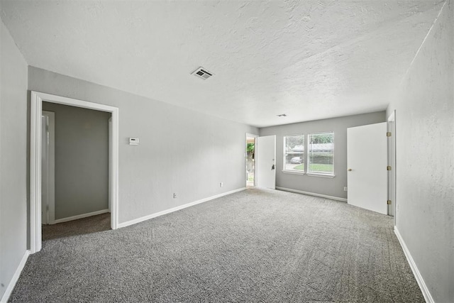 3534 Garden Pl, Oklahoma City, OK 73112 - carpeted spare room with a textured ceiling and baseboards