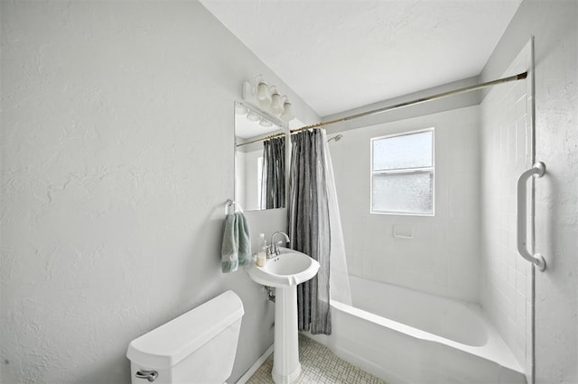 3534 Garden Pl, Oklahoma City, OK 73112 - bathroom with shower / bath combo with shower curtain, a textured wall, and tile patterned flooring