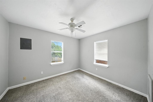 3534 Garden Pl, Oklahoma City, OK 73112 - spare room featuring electric panel, a ceiling fan, and carpet