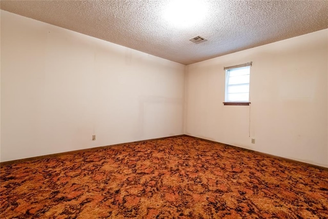 1319 N Cook, Cordell, OK 73632 - empty room featuring carpet floors and a textured ceiling