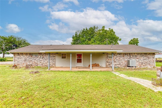 1319 N Cook, Cordell, OK 73632 - back of property featuring a patio, a yard, and stone siding