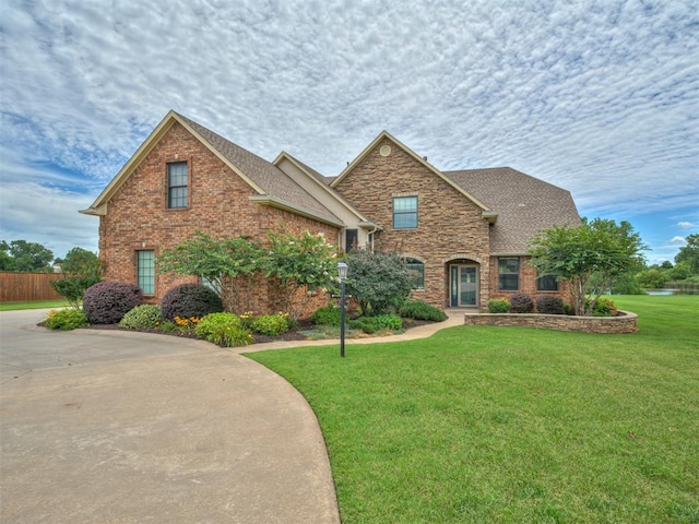 3004 Twin Lake Dr, Moore, OK 73165 - traditional-style house with a shingled roof and brick siding