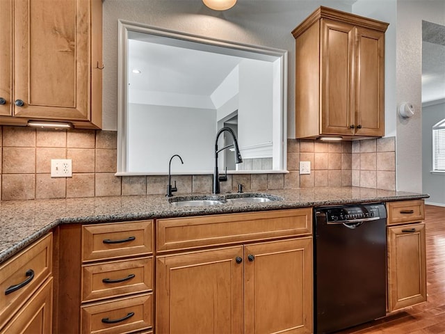 3004 Twin Lake Dr, Moore, OK 73165 - kitchen featuring dishwasher, wood finished floors, dark stone countertops, and brown cabinets